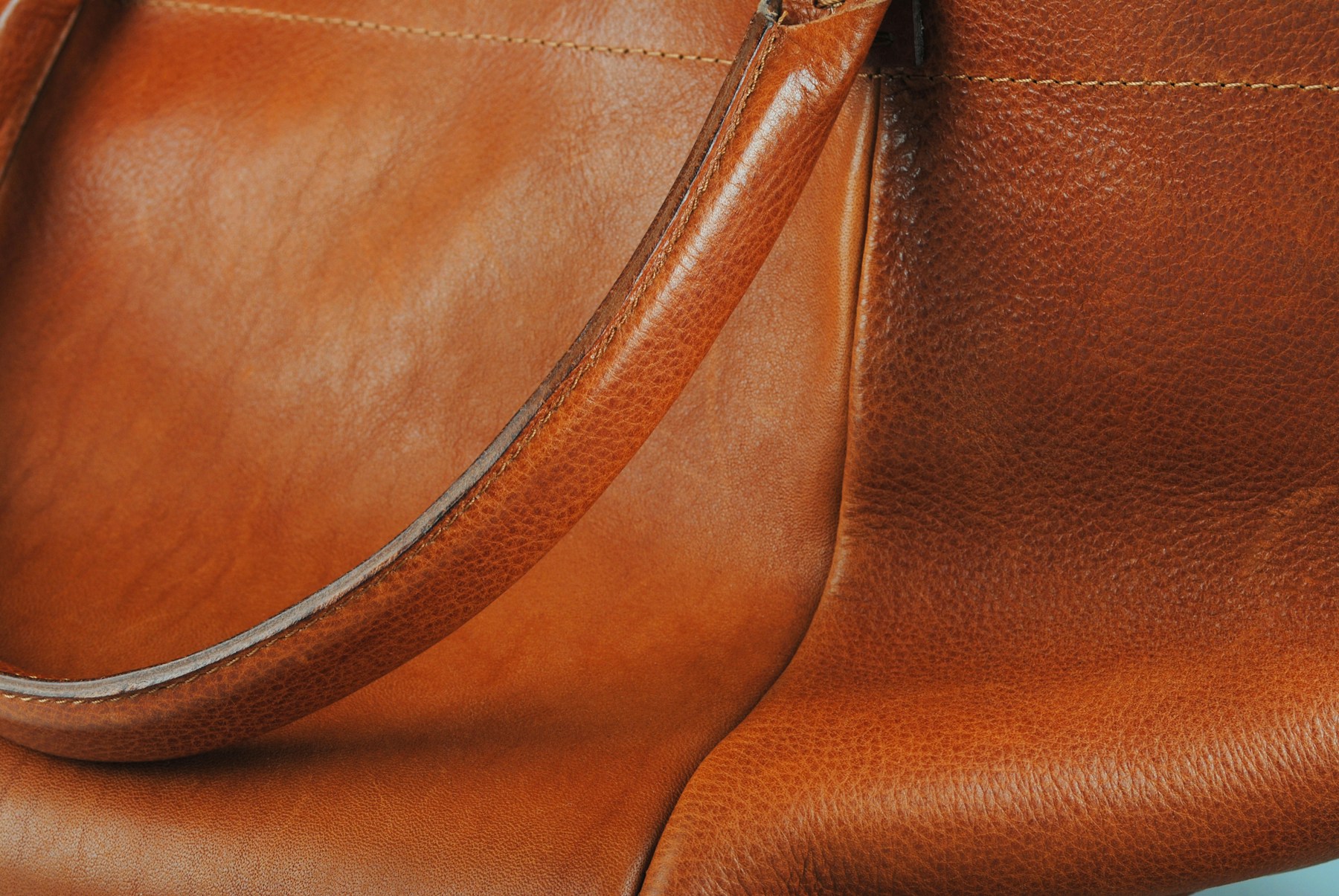 Leather handbag held by model